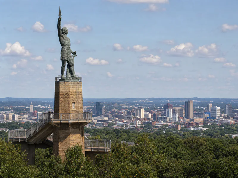 Vulcan statue and observation tower framed against Birmingham in daylight