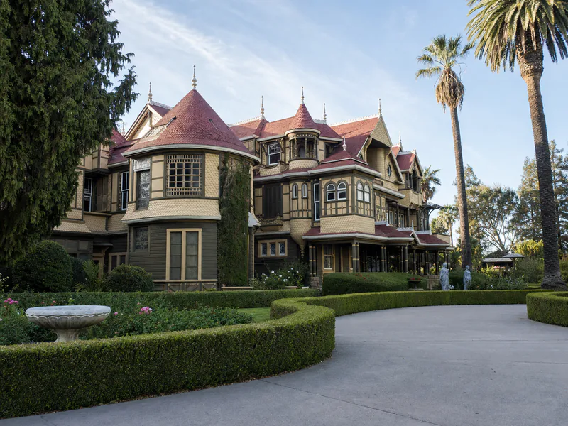 Victorian roofline and facade of the Winchester Mystery House in San Jose