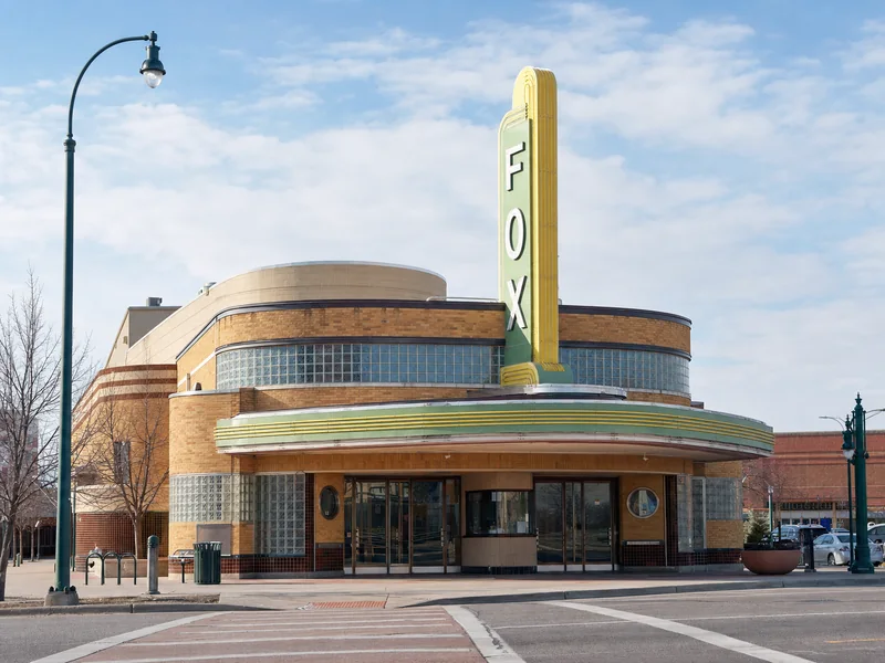 Restored vertical FOX sign and Streamline Moderne facade of the Aurora Fox Arts Center