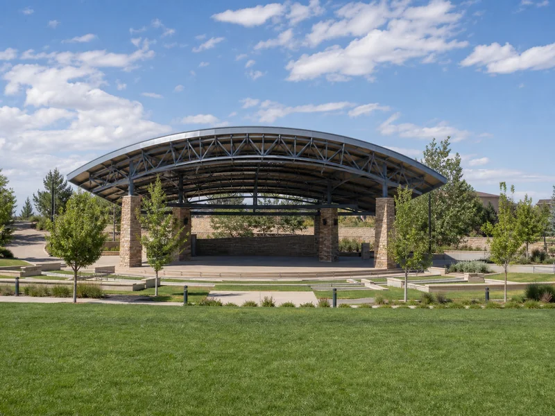 Signature amphitheater and curved shelters at Centennial Center Park