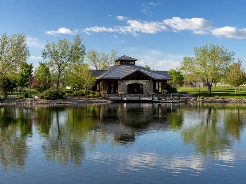 Carpenter Park lake and boathouse with landscaped park grounds in Thornton