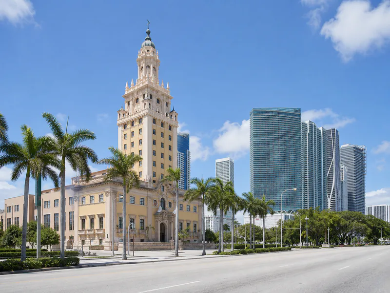 Freedom Tower with downtown Miami and palm trees