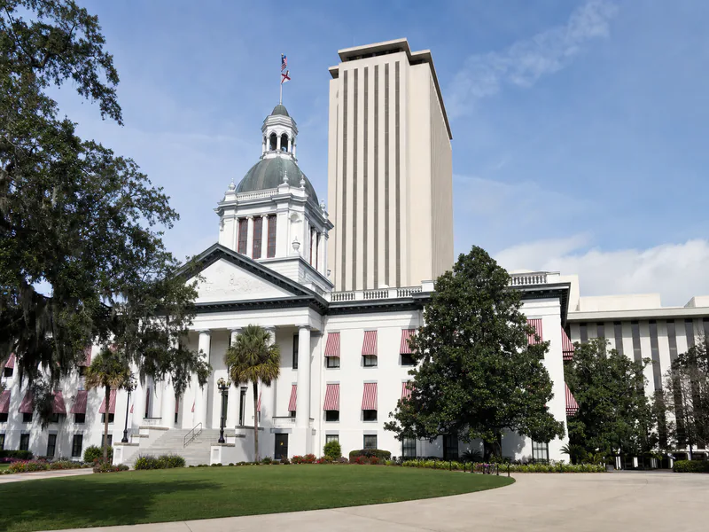 Historic Old Florida Capitol with striped awnings and dome in Tallahassee