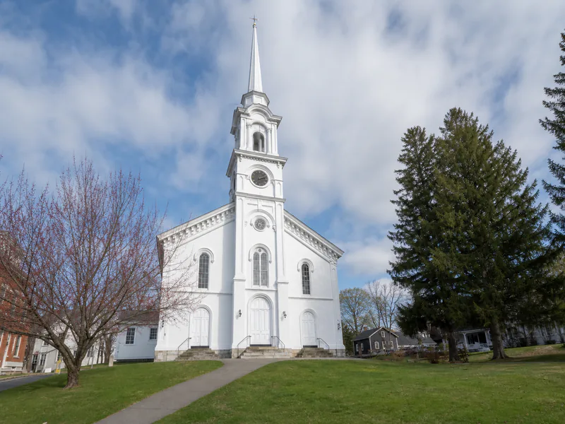First Congregational Church and its tall timber-framed steeple in Lee