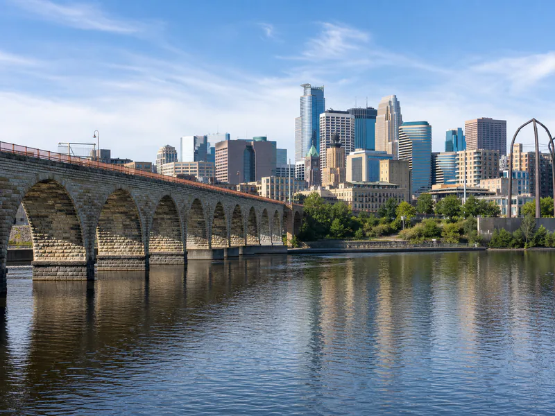 Stone Arch Bridge over the Mississippi River with the Minneapolis skyline