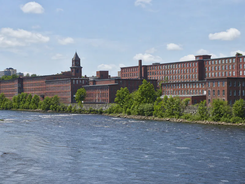 Historic brick mill buildings along the Merrimack River in Southern New Hampshire