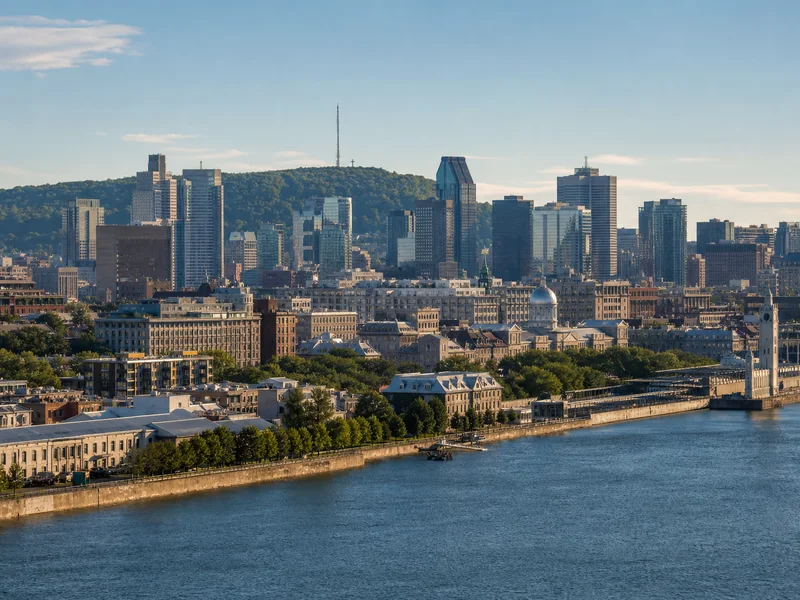 Old Port waterfront and the Montréal skyline with Mount Royal in clear summer light